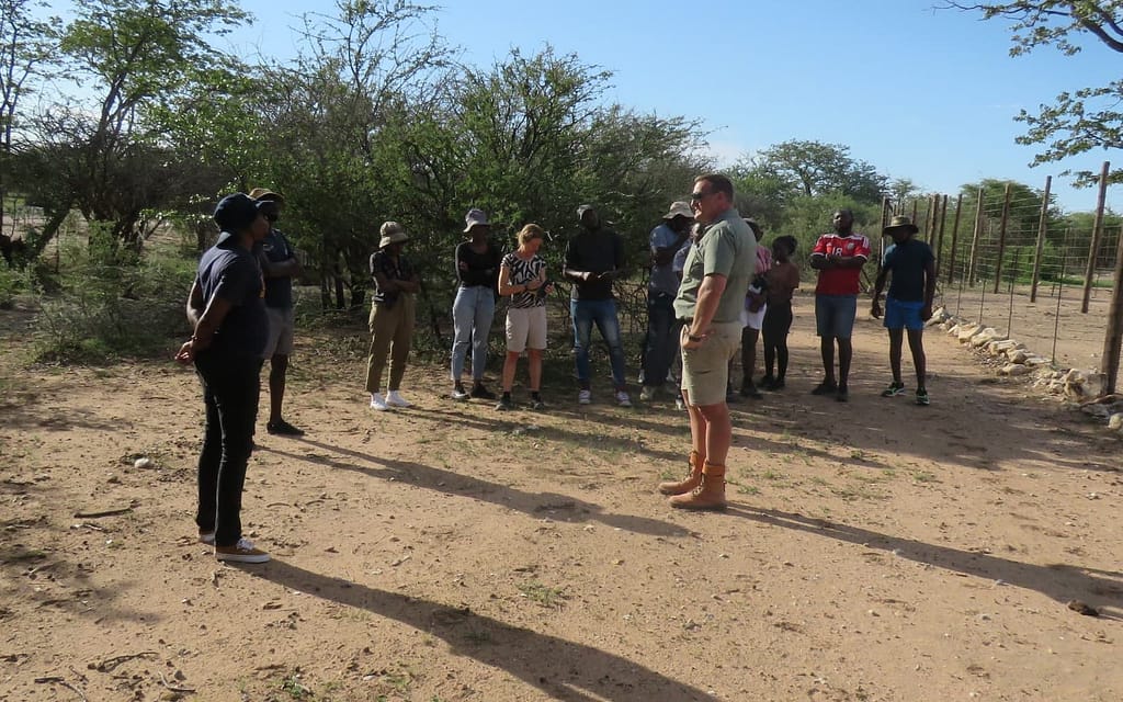 Lecturer and students in the bush.