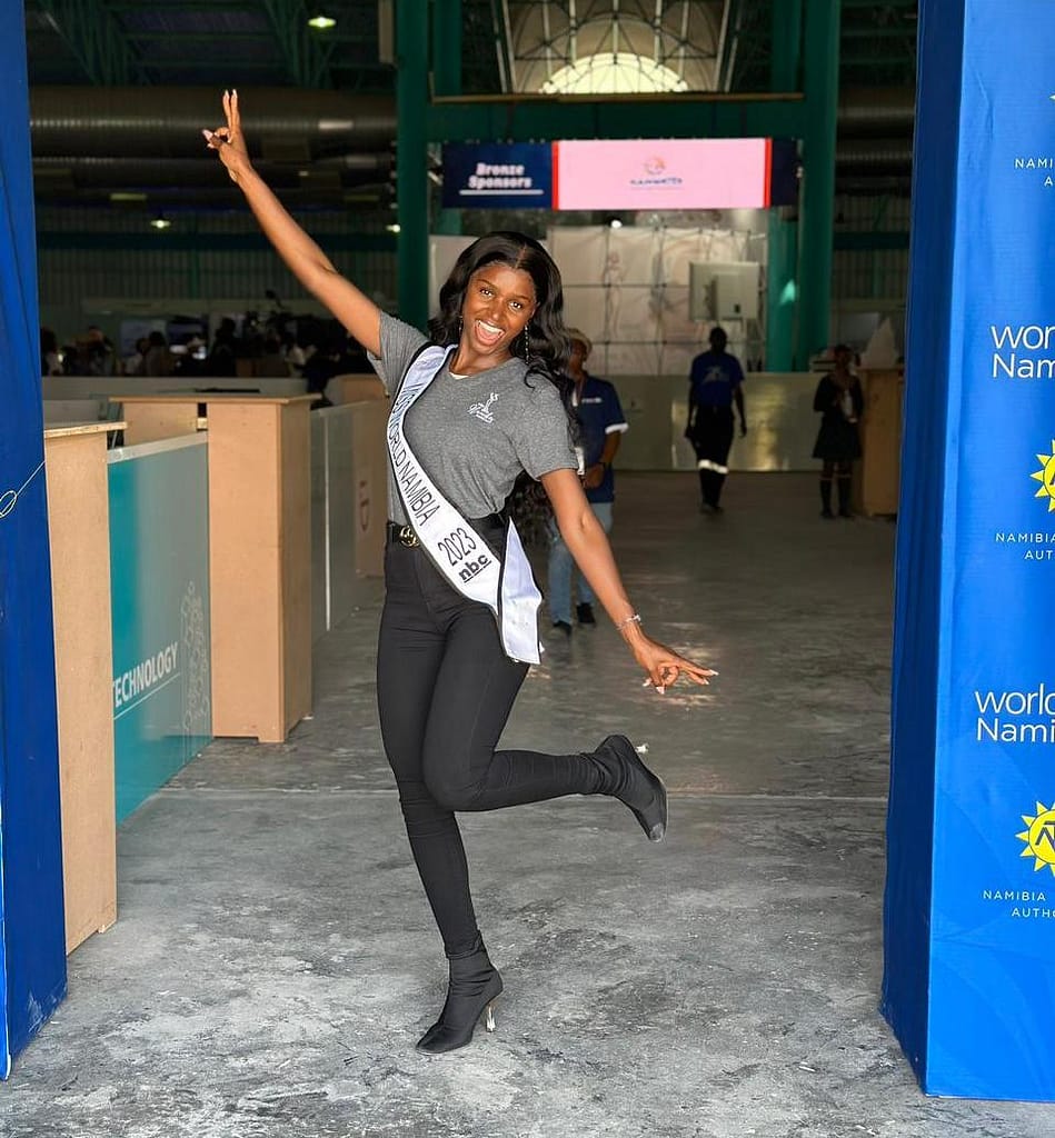 Miss World Namibia posing in a warehouse.